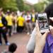 An audience member films the Gangnam style flash mob on the MIchigan campus Friday. Daniel Brenner I AnnArbor.com